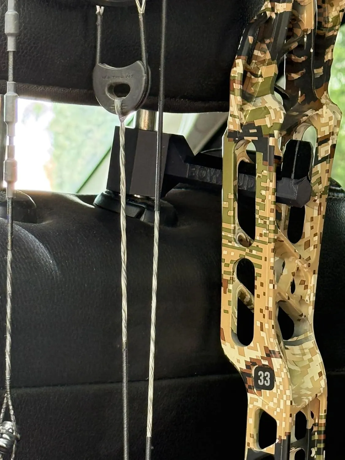 Original Bow Buddy  Headrest-Mounted Bow and Gear Hanger for Trucks & SUVs  Holds Bows, Backpacks, Hats, and More  Rubber Protector and Spacer Ring Included | Made in USA | No-Tool Install